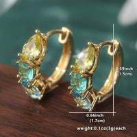 Gouden oorbellen met gele en blauwgroene edelstenen