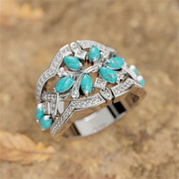 Zilveren ring met turquoise blaadjes en zirkonia