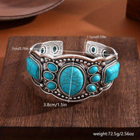 Gouden oorbellen met turquoise druppelsteen