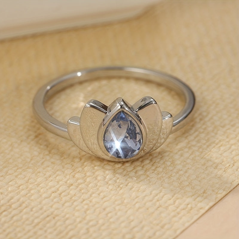 Zilveren lotusring met druppelvormige blauwe steen