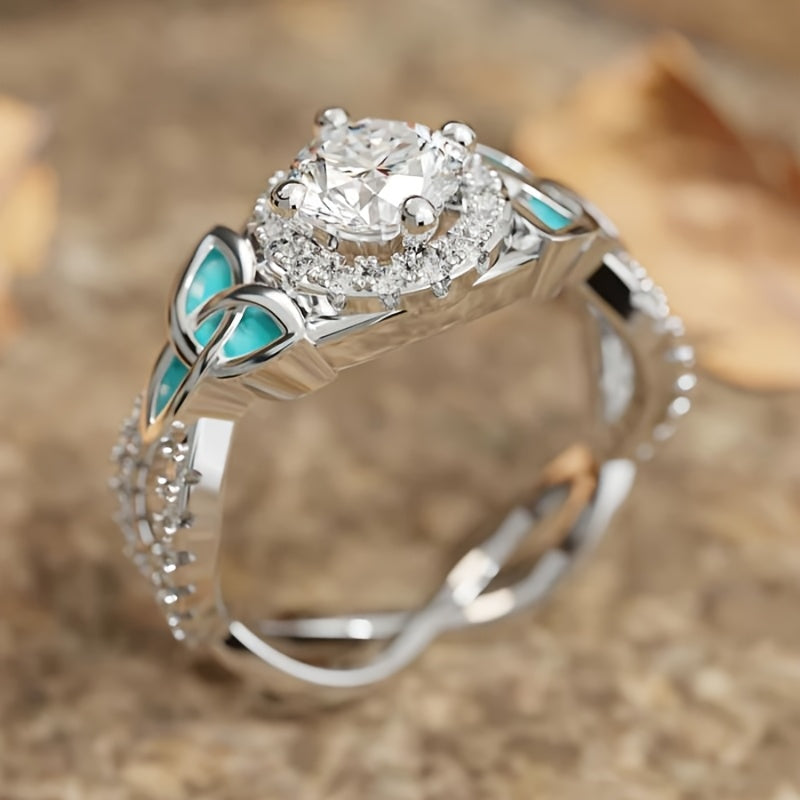 Zilveren ring met zirkonia en turquoise emaille blaadjes