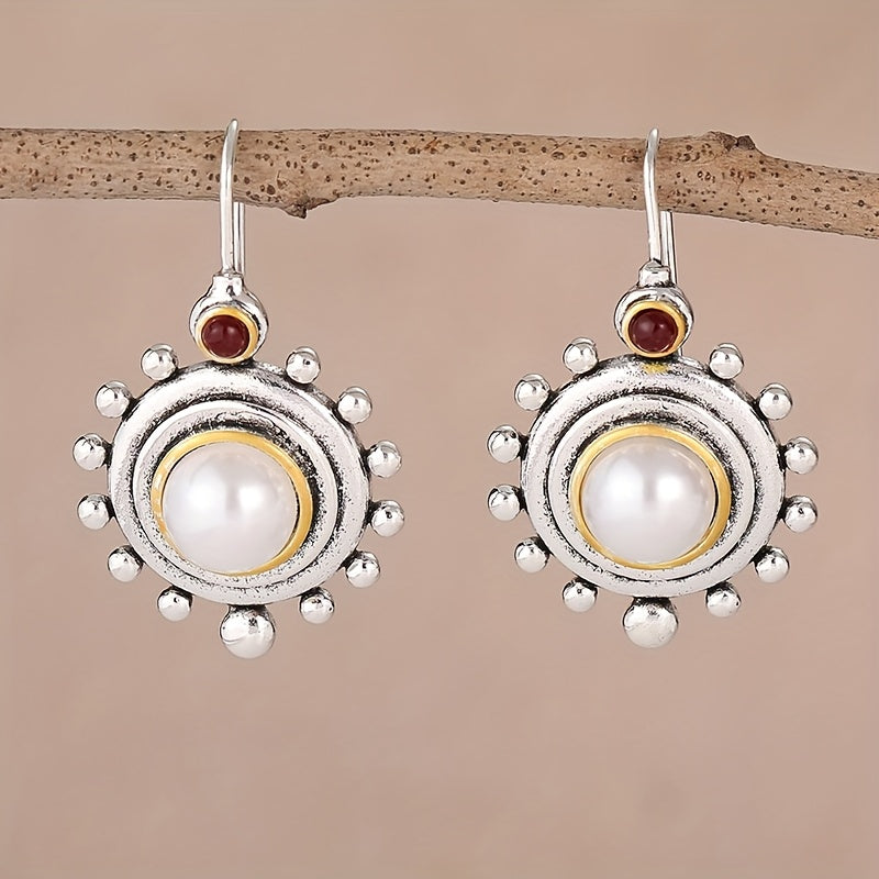 Vintage oorbellen met parel en rode steen