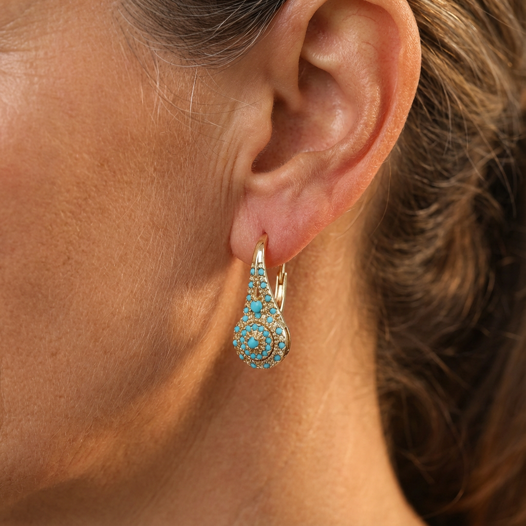 Gouden vintage oorbellen met turquoise rozet