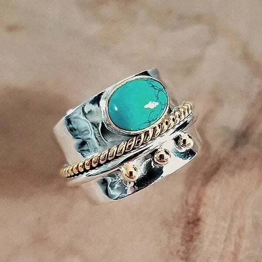 Zilveren brede ring met turquoise en goudaccenten