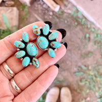 Zilveren oorbellen met ruitvormige turquoise hanger
