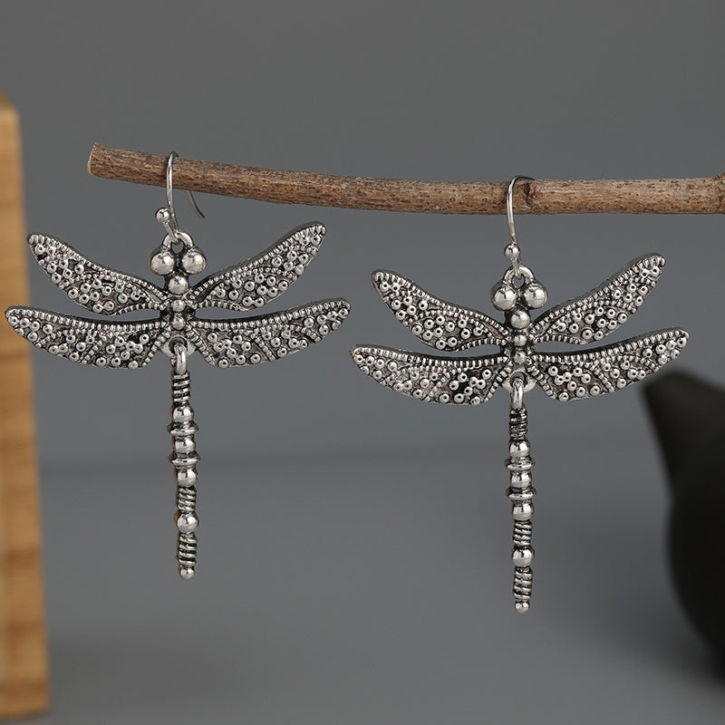 Zilveren bohemian oorbellen met libelle