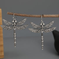 Zilveren bohemian oorbellen met libelle
