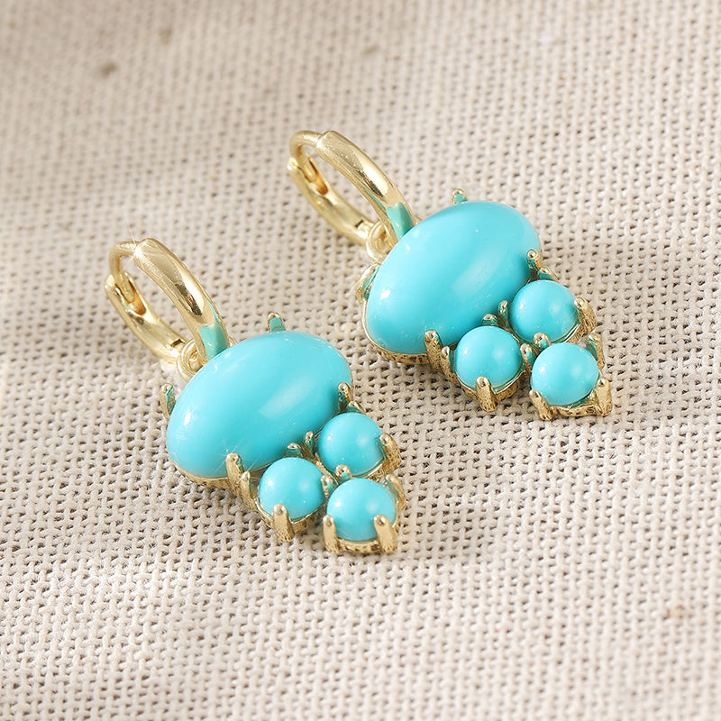 Gouden oorbellen met ovale turquoise en kraaltjes