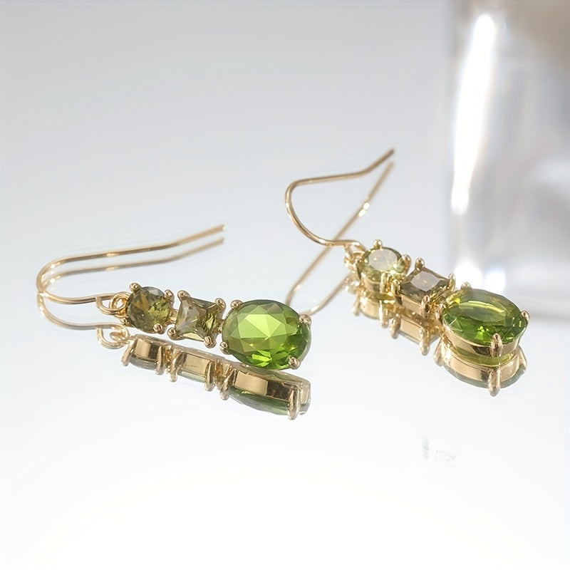Gouden oorbellen met groene en gele edelstenen