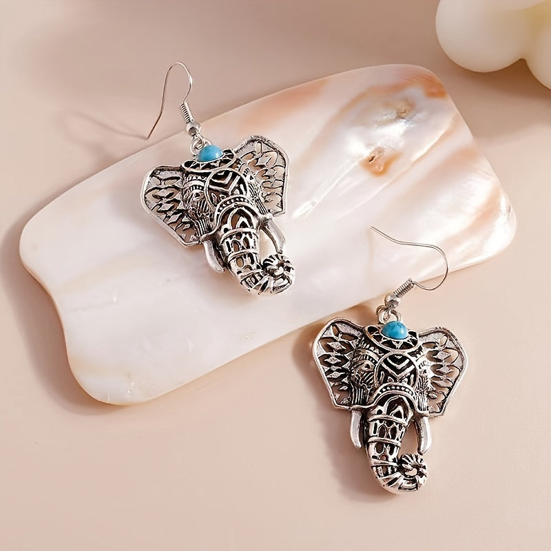 Zilveren boho olifant oorbellen met turquoise