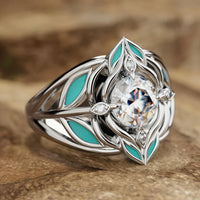 Zilveren ring met zirkonia en turquoise emaille blaadjes
