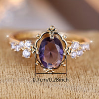 Gouden vintage ring met ovale paarse edelsteen