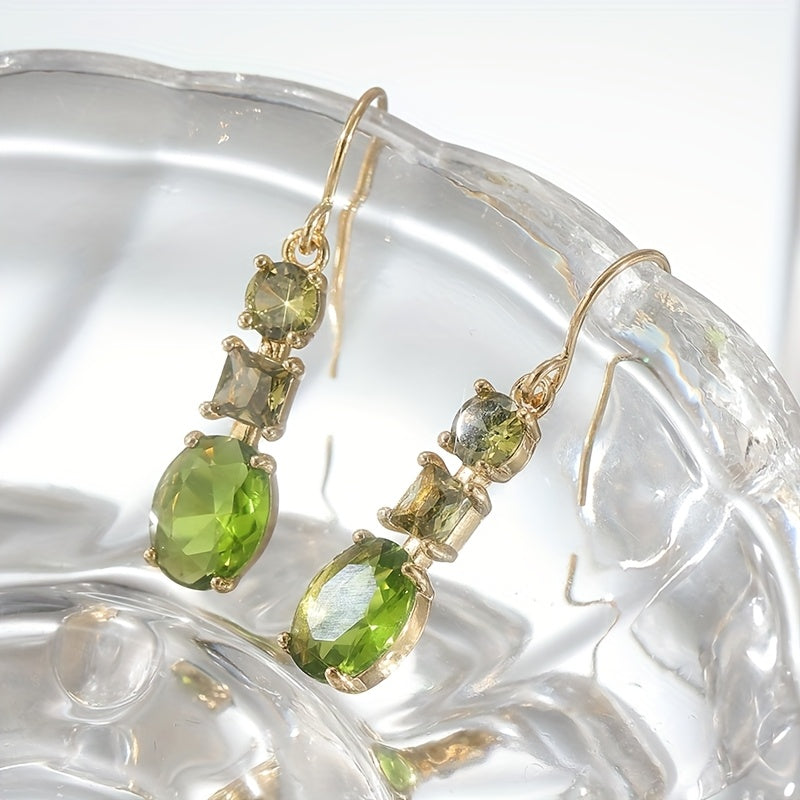 Gouden oorbellen met groene en gele edelstenen