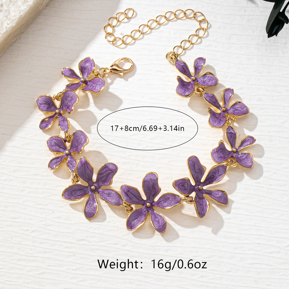 Gouden armband met paarse emaille bloemen