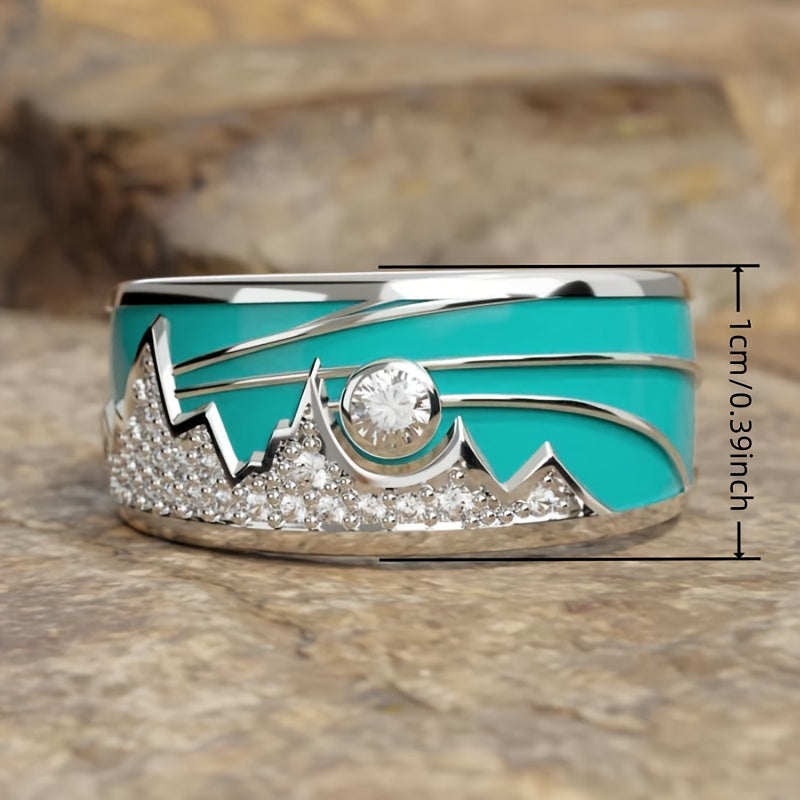 Zilveren ring met turquoise emaille berg-zonmotief en zirkonia