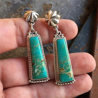 Zilveren oorbellen met turquoise staaf