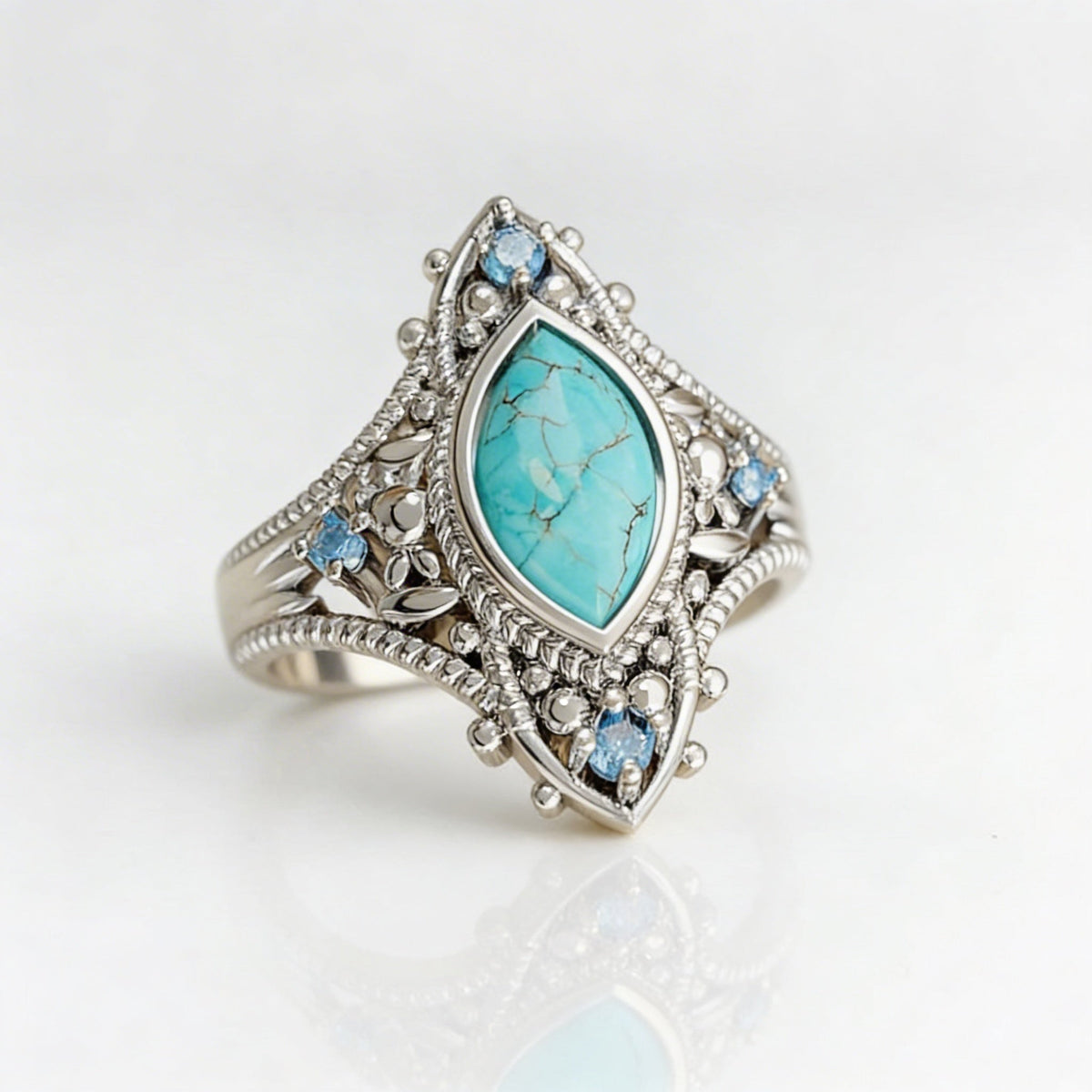 Zilveren vintage ring met marquise turkoois en blauwe steentjes
