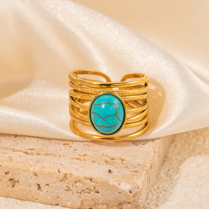 Gouden ring met ovale turquoise edelsteen