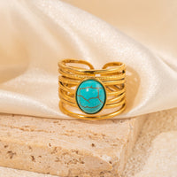 Gouden ring met ovale turquoise edelsteen