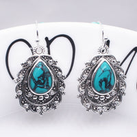 Zilveren vintage filigraan oorbellen met turquoise druppel