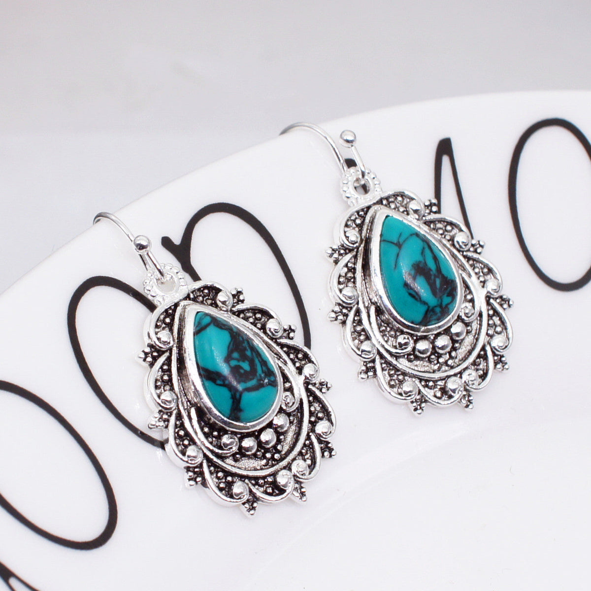 Zilveren vintage filigraan oorbellen met turquoise druppel