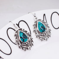 Zilveren vintage filigraan oorbellen met turquoise druppel