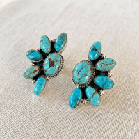 Zilveren oorbellen met ruitvormige turquoise hanger