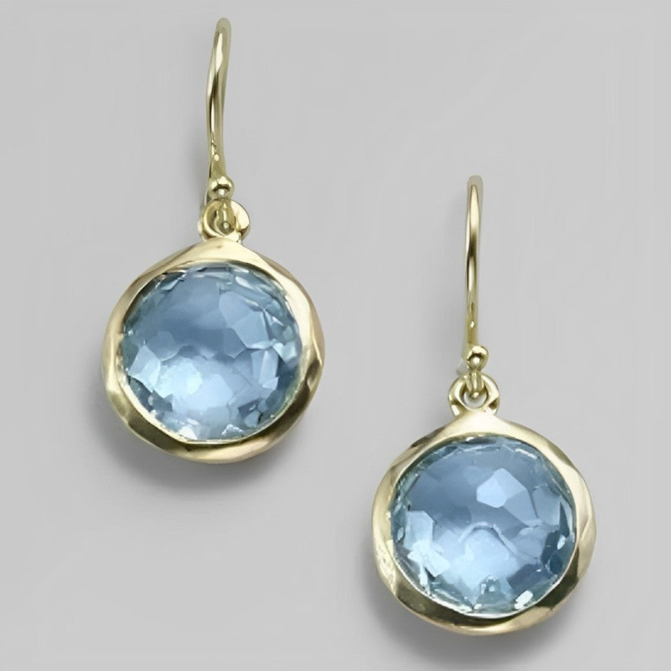 Gouden oorbellen met blauwe topaas