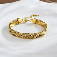 Brede gouden gevlochten mesh-armband