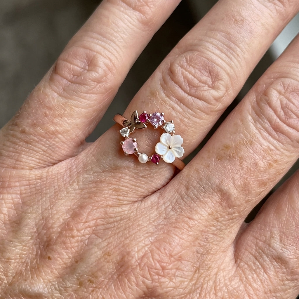 Roségouden ring met bloemkrans, parel en gekleurde zirkonia