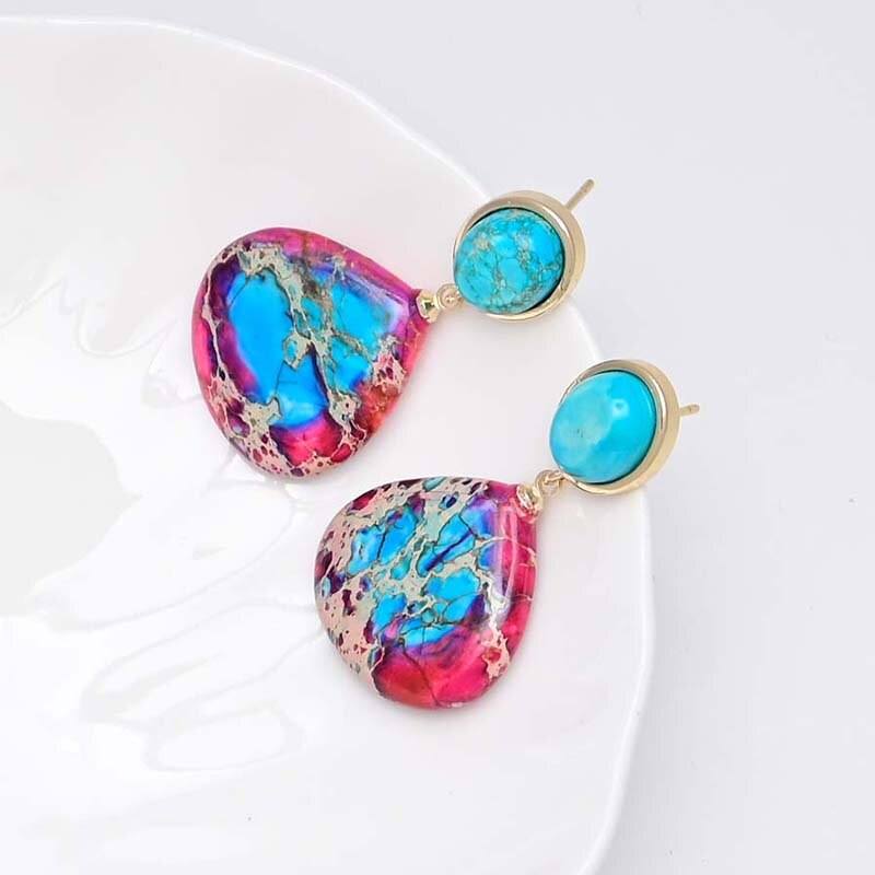 Gouden oorbellen met turkoois en roze-blauwe jaspis