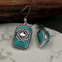 Bohemian zilveren oorbellen met turquoise en Azteeks motief