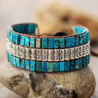 Boho leren armband met turquoise tegels en bloemband