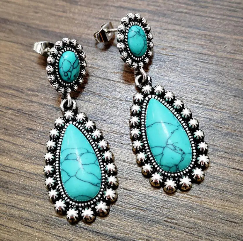 Western zilveren hangoorbellen met turquoise druppel