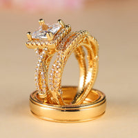 Gouden ringenset met princess-geslepen zirkonia en gevlochten band