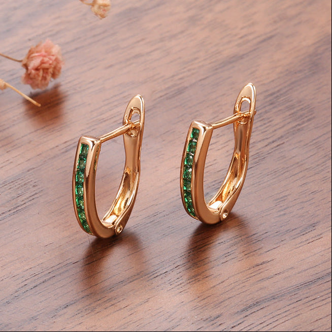 Gouden oorbellen met groene zirkonia