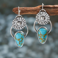 Zilveren vintage oorbellen met turquoise en zonnestraal