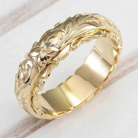Gouden vintage ring met gegraveerd bloemmotief