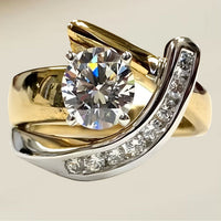Gouden ring met ronde zirkonia en gekruiste band