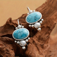 Zilveren vintage oorbellen met turquoise en parel