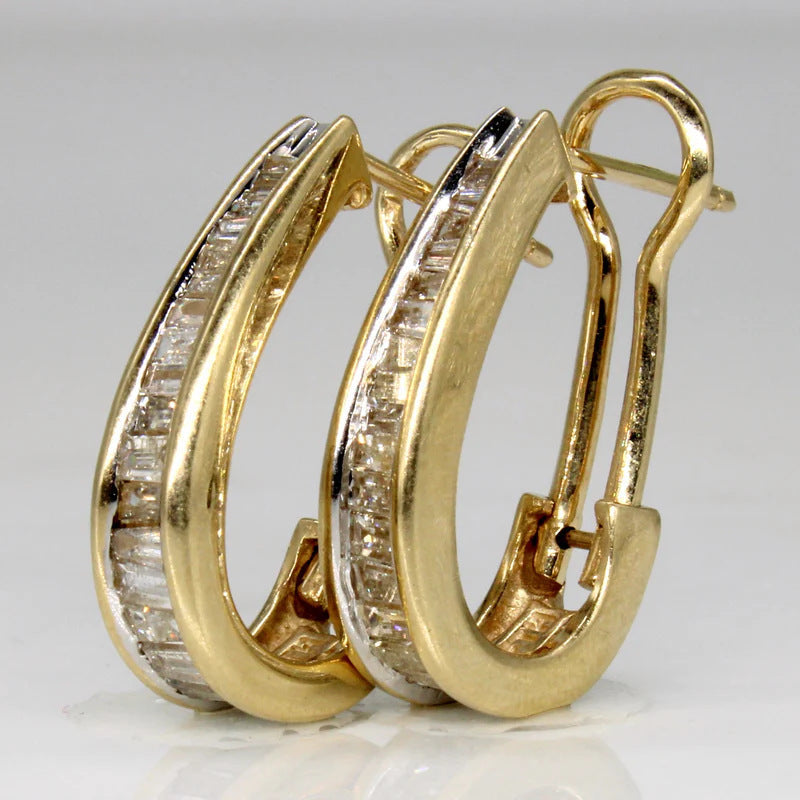 Gouden oorbellen met baguette zirkonia en omega-sluiting