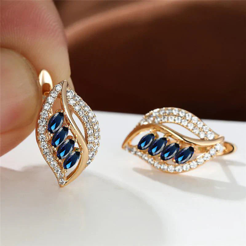 Gouden oorbellen met blauwe bladmotief