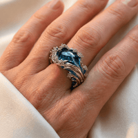 Zilveren golfring met blauwe edelsteen