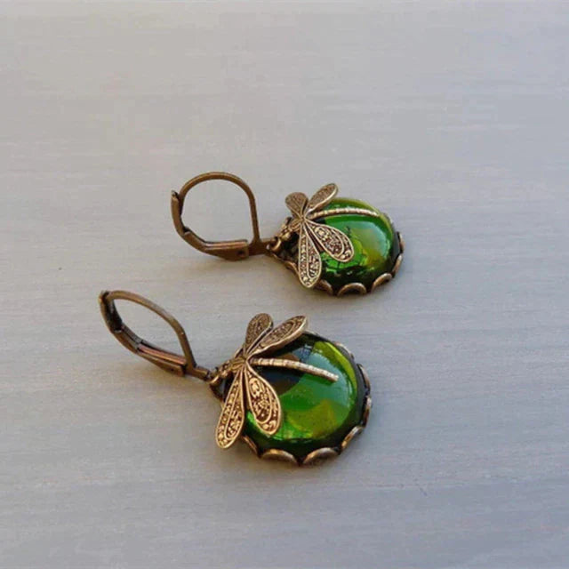 Vintage oorbellen met libelle en blauwe steen