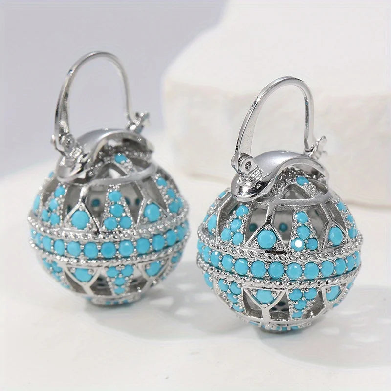 Gouden bolhanger-oorbellen met turquoise kralen