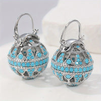 Gouden bolhanger-oorbellen met turquoise kralen