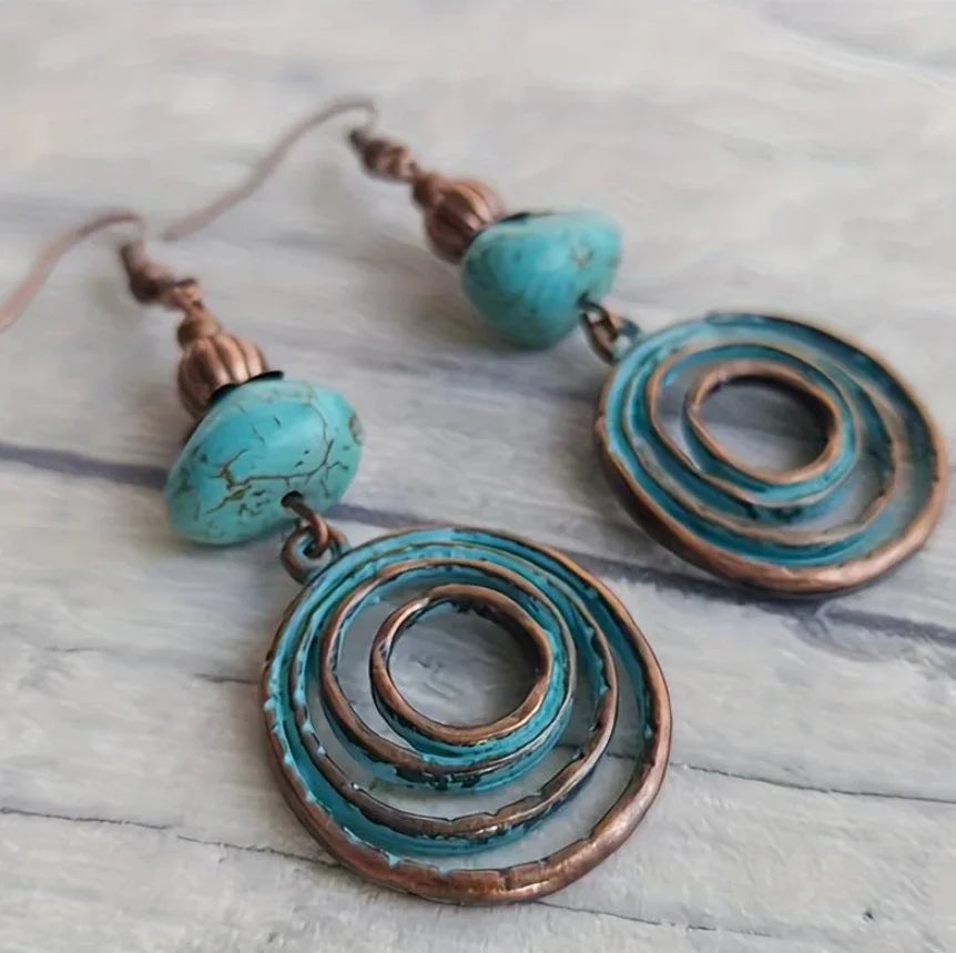 Zilveren bohemian oorbellen met rode edelstenen