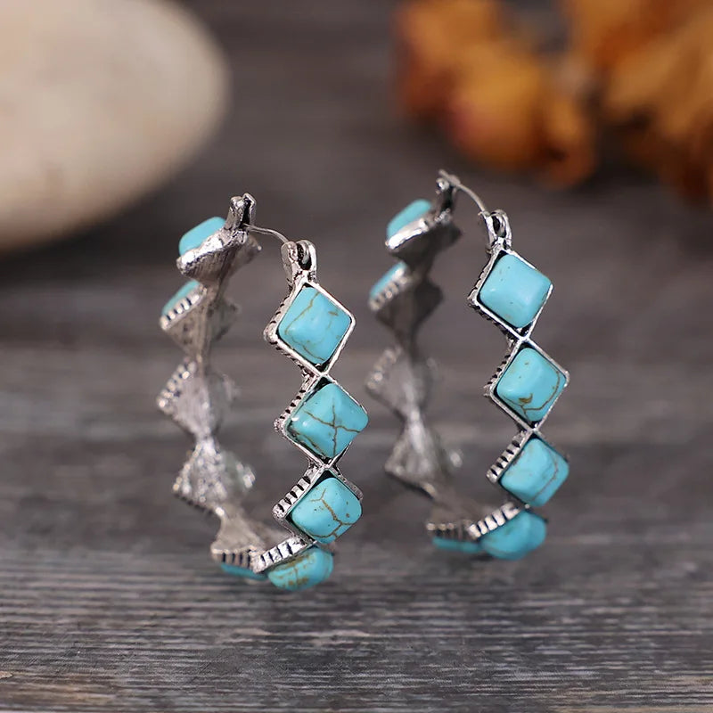Zilveren oorbellen met turquoise kralen en kristal