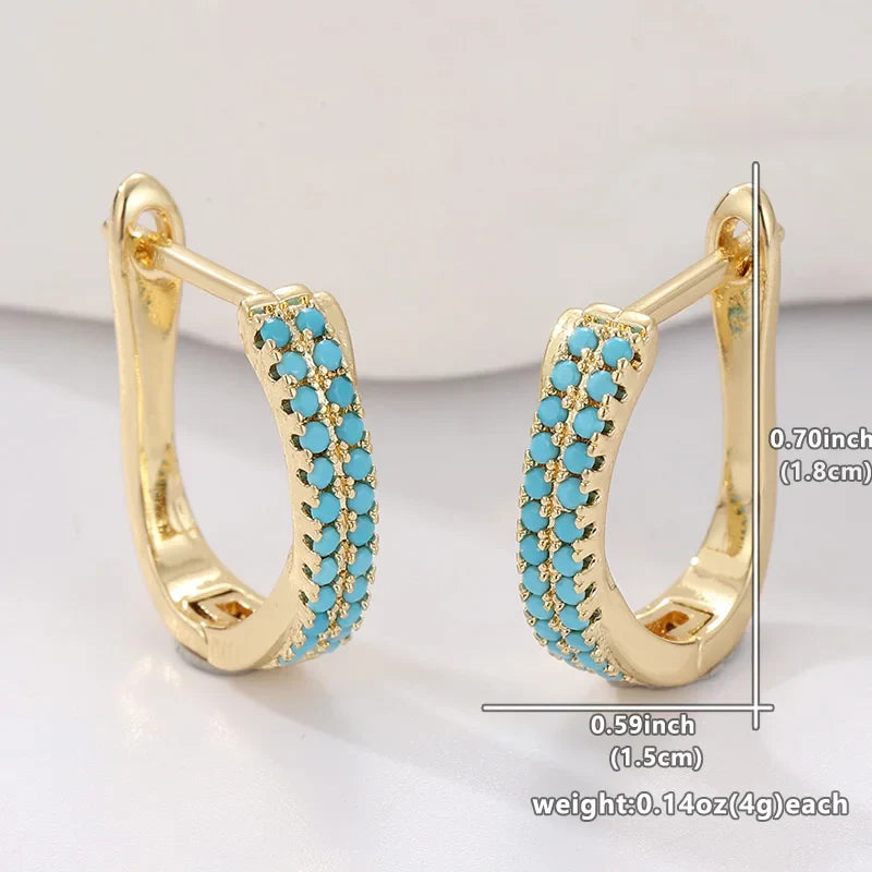 Gouden huggie-oorbellen met turquoise pavé