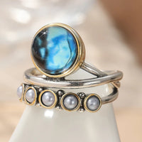 Zilveren ringenset met blauwe steen en parels